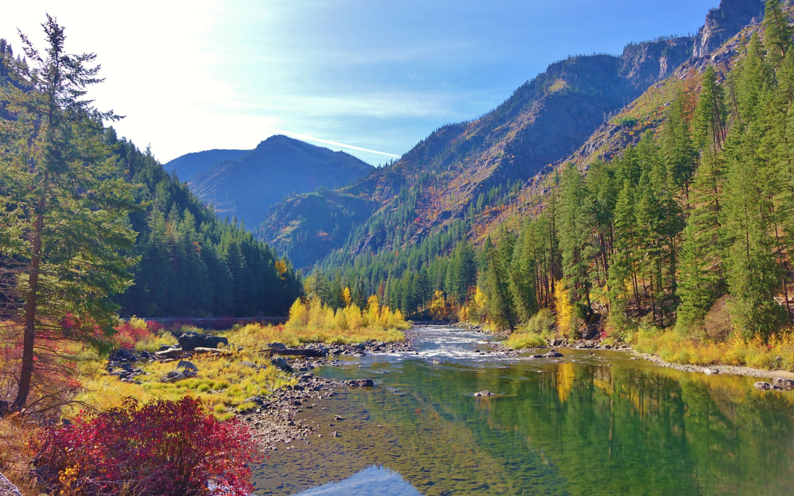 Gorgeous view of the Wenatchee River as seen from the middle of the pond looking up to the top of the valley during the best time to visit Washington State