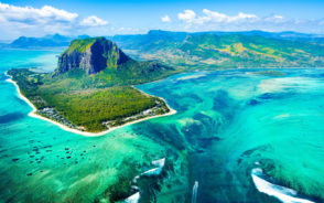 Aerial image of Mauritius pictured with the teal blue waters and the gorgeous reef seen from the air