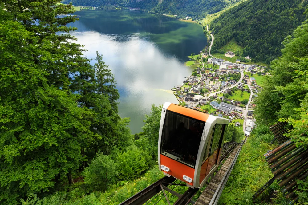 Neat cable car making its way up the hill to Salzwelten, Hallstatt, pictured during the best time to go to Austria