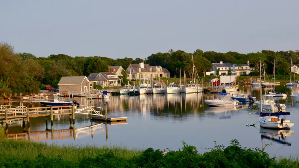 Neat late-afternoon view of Wychmere Harbor on a summar afternoon in Harwich during the best time to go to Cape Cod