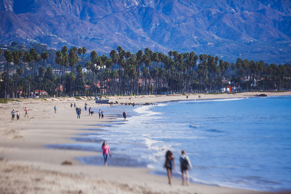 Ocean front view of beachgoers for a frequently asked questions section on the best time to visit Santa Barbara