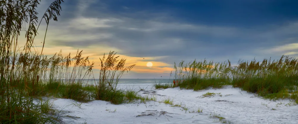 Panoramic sunset view over Holmes Beach showing why you should visit Anna Maria Island