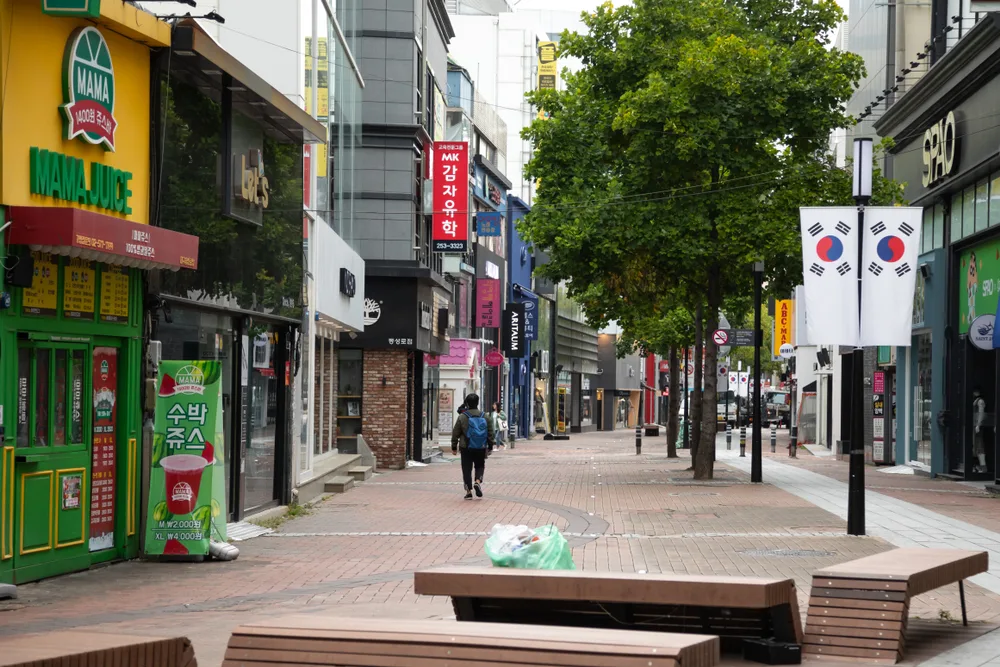 South Korea pictured during the least busy time to visit with an empty street in Janggwan-Dong, Daegu with a single person walking on a brick path