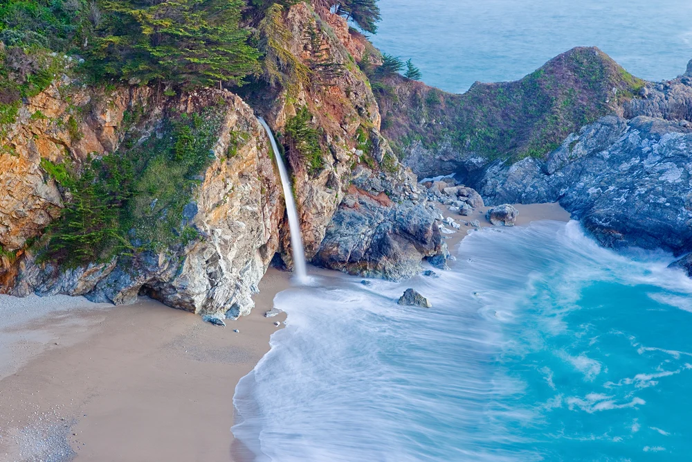 Amazing overhead view of McWay Falls pictured during the best time to visit Big Sur
