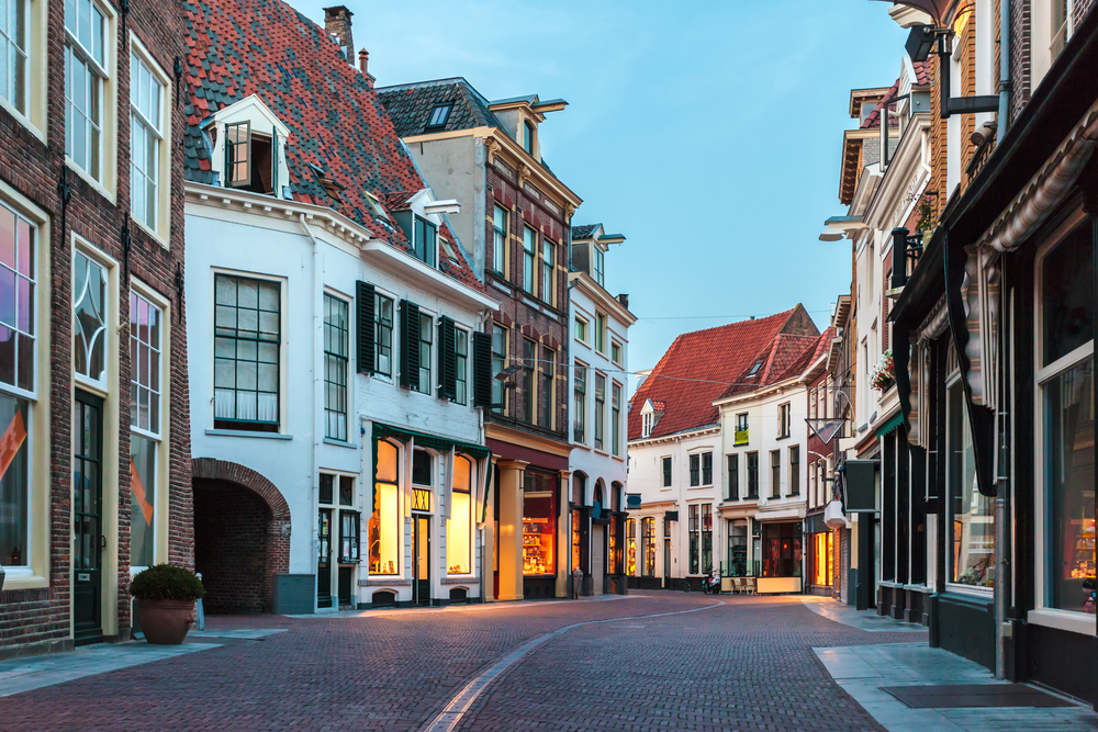 Evening in the ancient Dutch town of Zutphen pictured during the least busy time to visit the Netherlands with empty streets and a semi-dark sky
