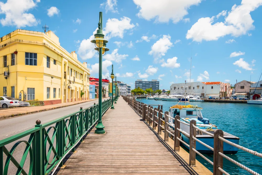 Promenade along the boardwalk in Barbados pictured during the best time to visit with warm weather and low traffic