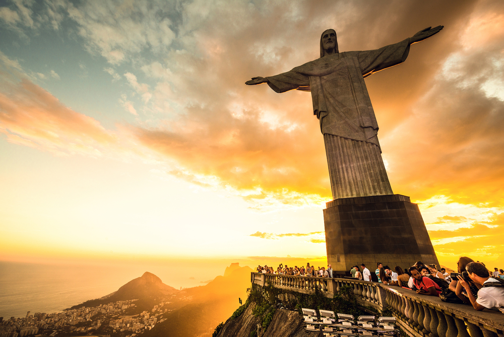 Photo of the Christ statue at dusk during the best time to visit Rio de Janeiro as seen from the perspective of a visitor at the foot of the statue