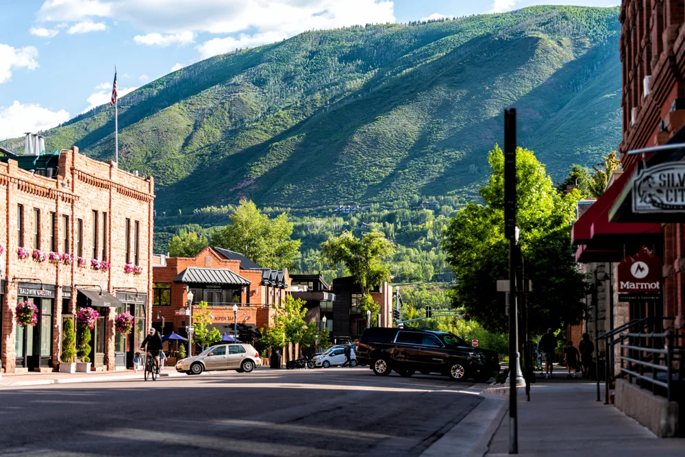 Gorgeous Spring view of the downtown area looking up into the mountains for a piece on the least busy time to visit Aspen