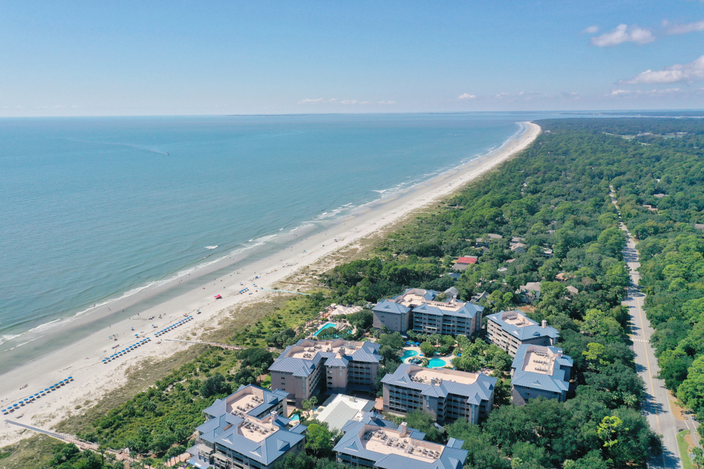 Gorgeous aerial shot of the empty white sand beaches during the best time to visit Hilton Head
