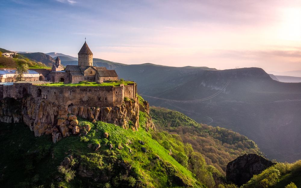 Distant view of Tatev Monastery in the mountains for a piece on Is Armenia Safe to visit