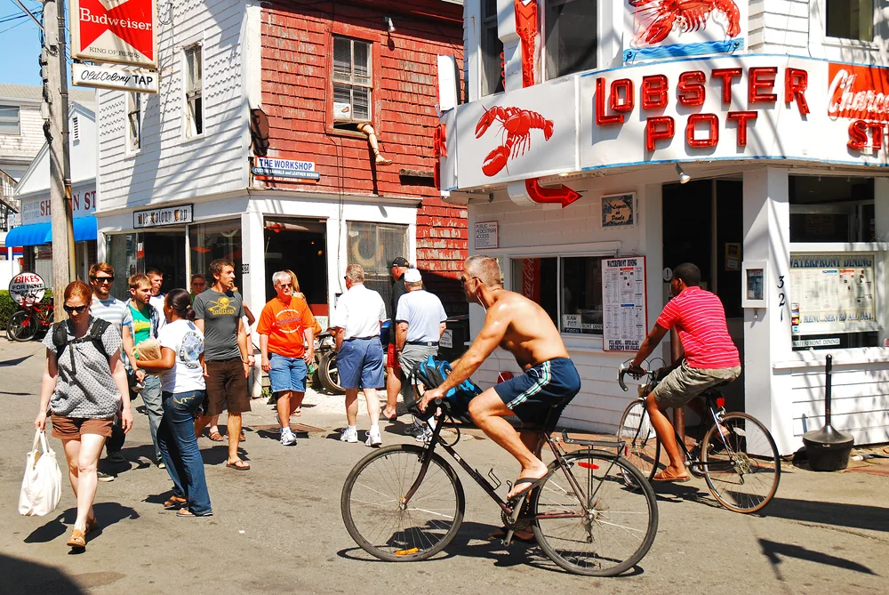 Image of a crowded street outside the Lobster Pot in Provincetown during the Summer, the worst time to visit Cape Cod