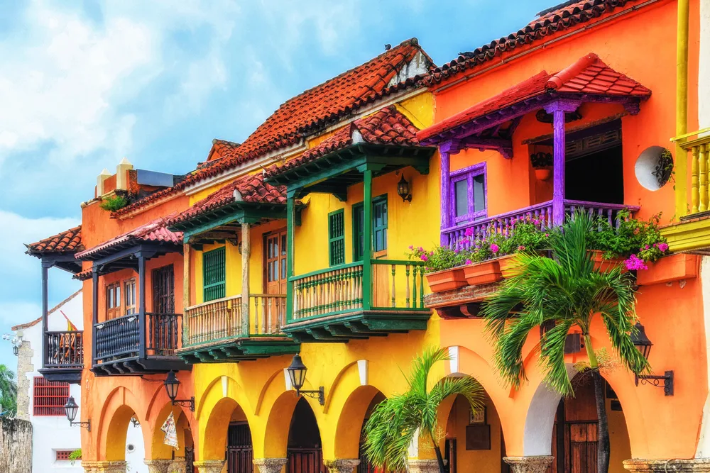 Colorful buildings in Plaza de los Coches showing the best time to visit Cartagena