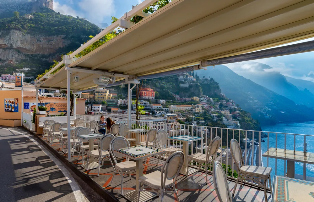 Restaurant in Positano with a bunch of empty tables during the off-season, one of the least busy times to visit the Amalfi Coast