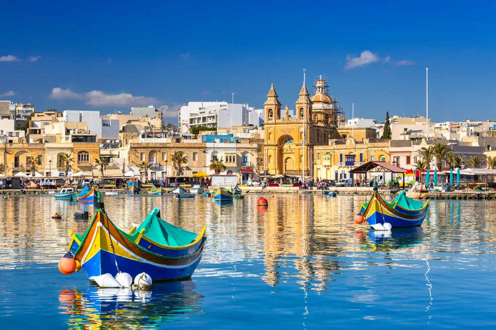 Image of Marsaxlokk Village in coastal Malta shows the best time to visit Malta for great weather and activities