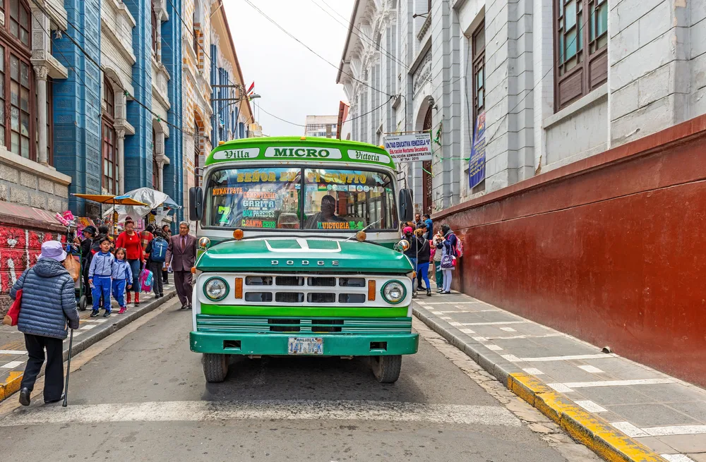 Green bus for transportation in La Paz for a piece on Is Bolivia Safe