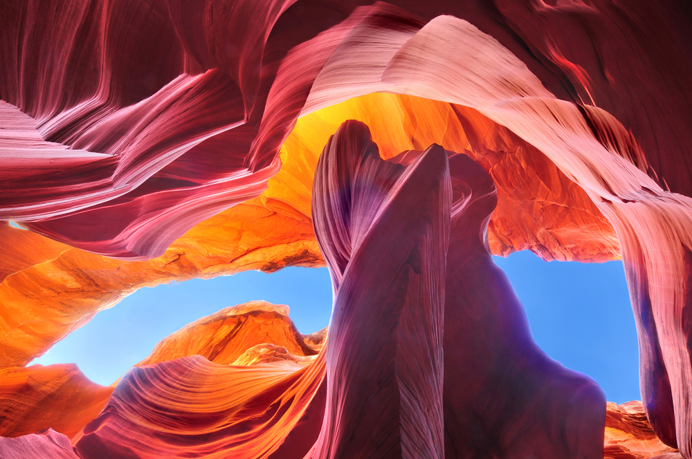 Gorgeous view looking up at the top of the rock formation during the best time to visit Antelope Canyon