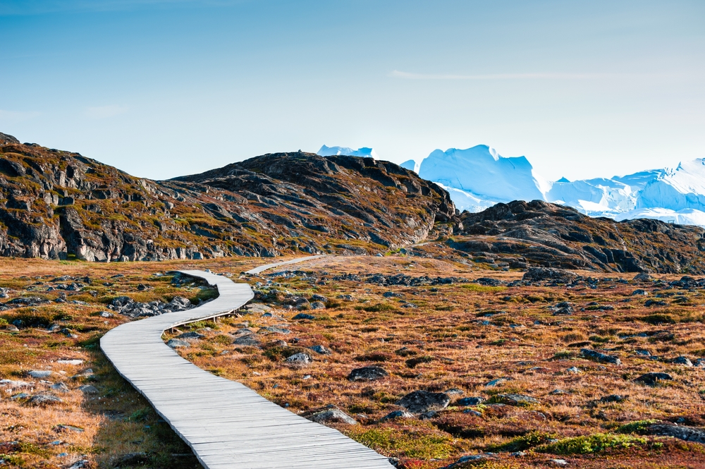 Hiking trail to the Ilulissat fjord with icebergs pictured in autumn, the least busy time to visit Greenland