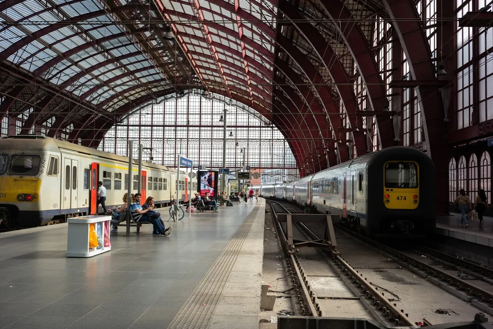 Photo of the Antwerp Station seen on a gorgeous day with its picturesque and grand glass ceiling, as seen during the best time to visit Belgium