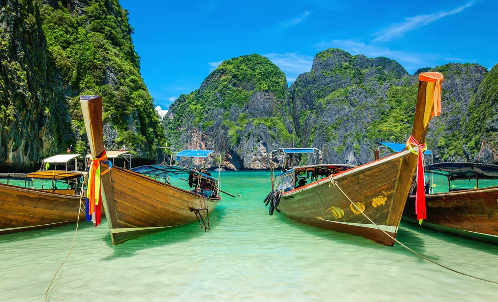 Photo of boats anchored off the coast of Maya Bay on Phi Phi islands, near Bangkok
