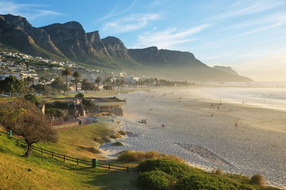 Amazing view of a slight fog over Camps Bay Beach with the Twelve Apostles in the background