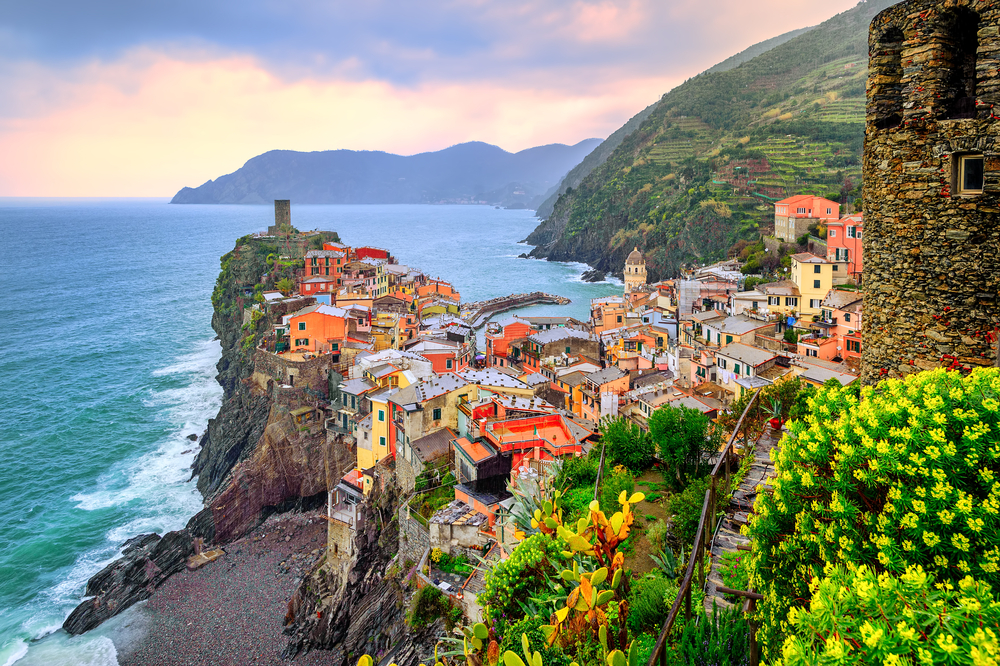 Seaside Vernazza at sunset shows ideas for where to stay in Cinque Terre