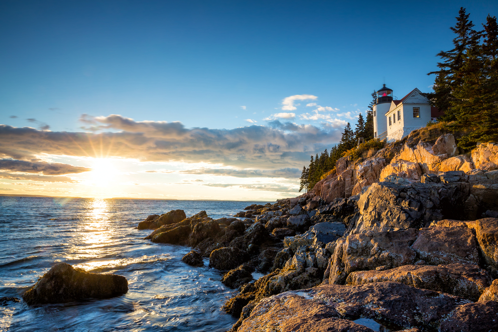 Dusk snapshot of the coastal lighthouse in Acadia National Park, which is perched on a rock overlooking the bay