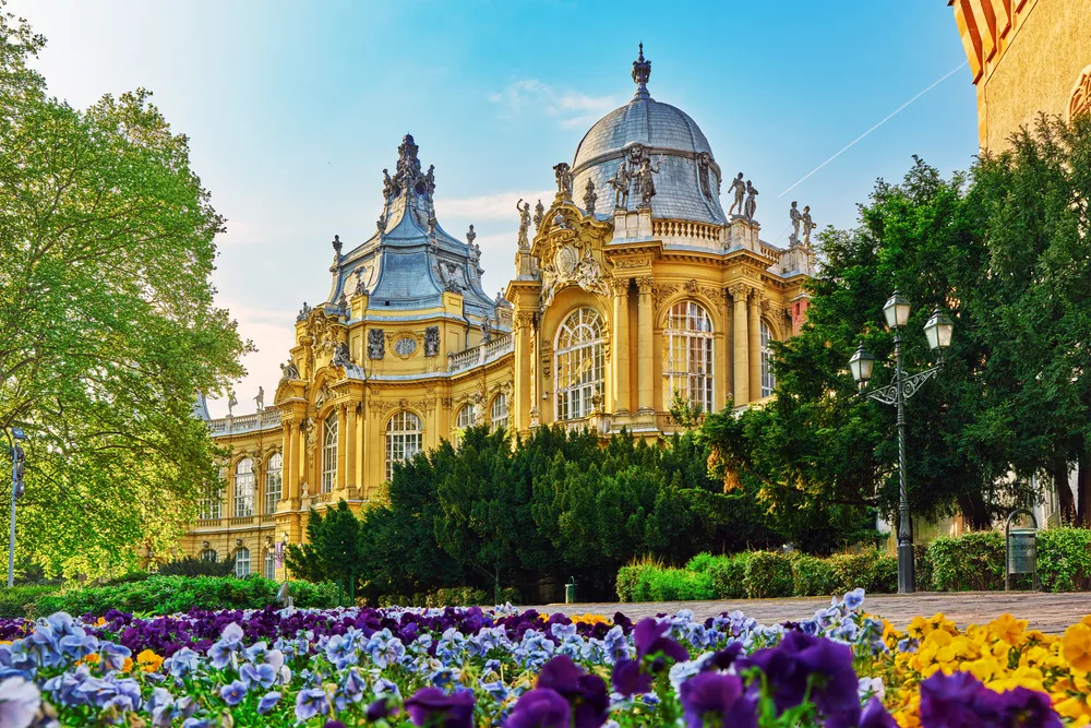 Vajdahunyad Castle with flowers in bloom shows why you should visit Budapest