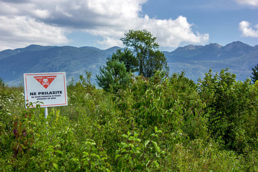 Mine field signage in Croatia shows a very unsafe area in a piece on Is Croatia Safe