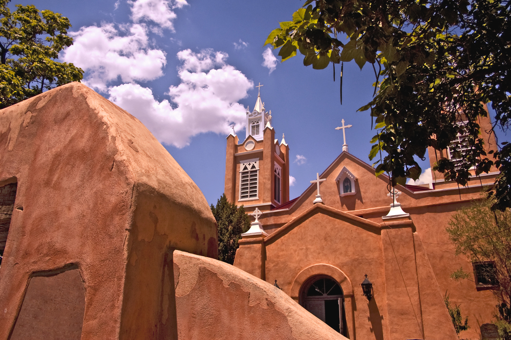 Neat and historic San Felipe de Neri church with clay walls during the best time to visit Albuquerque