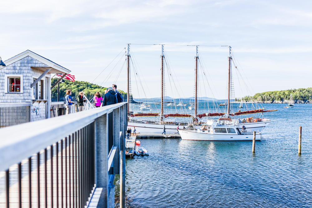 People boarding a sailboat during the Summer, the most crowded and worst time to visit Bar Harbor Maine