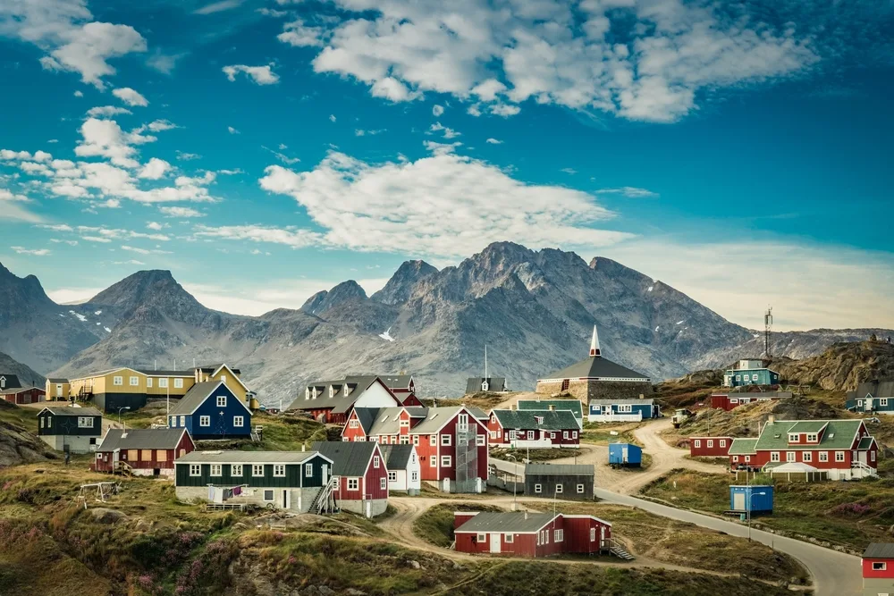 Neat and quaint little town in Greenland pictured during the best time to visit without snow on the ground