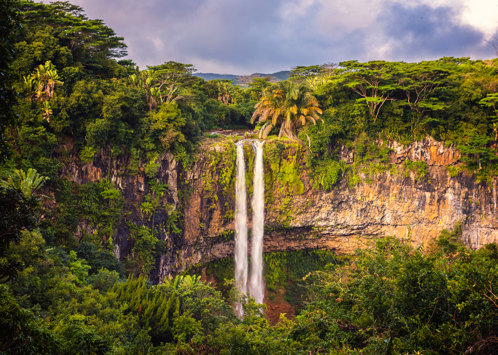 Rainy season in Mauritius, the overall worst time to visit, with clouds over the amazingly gorgeous Chamarel waterfall