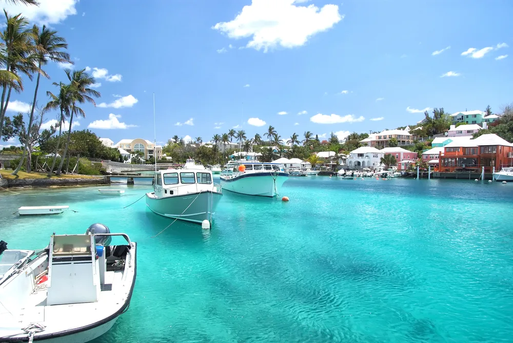 Gorgeous view of teal water in the bay of Hamilton on a clear day for a piece on where to stay in Bermuda