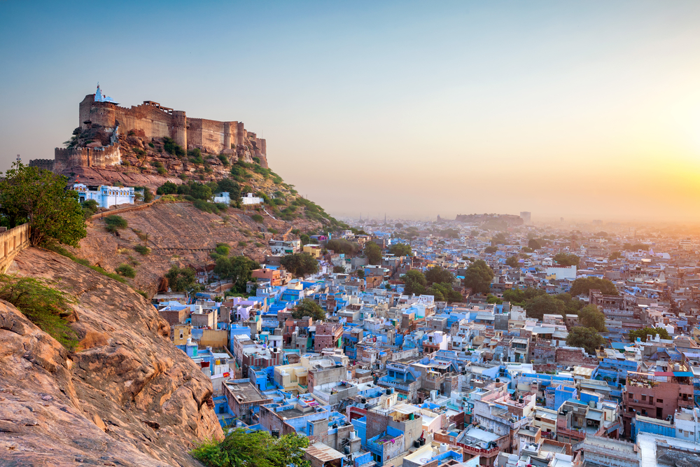 Hilltop view of the blue city and Mehrangarh Fort in Jodhpur in Rajasthan, pictured during the cheapest time to visit India