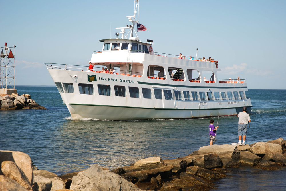 Old white ferry boat arriving in Oak Bluff during the best time to visit Martha's Vineyard, the Spring or Fall