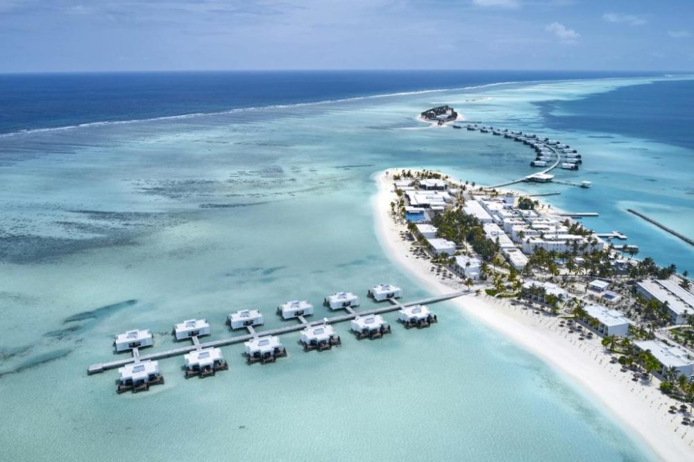 Aerial shot of the Riu Atoll, one of the best Maldives resorts, with bungalows attached to the main resort