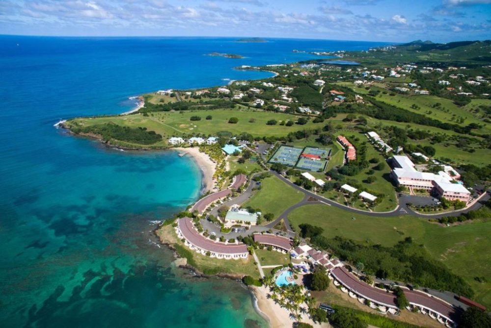 Aerial view of the Buccaneer Beach Resort in St. Croix, one of the best resorts in the Virgin Islands, showing the golf course and the rooms