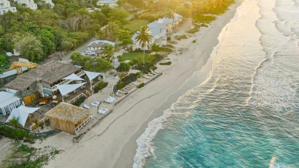 Long Bay Beach Resort, one of the top-rated resorts in the Virgin Islands, pictured from the air looking down on the beach and water