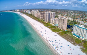 Aerial view of Marco Island, pictured during the overall best time to visit, pictured with clear skies and blue water