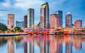 Downtown skyline of Tampa pictured on a still day with the buildings reflecting in the water for a guide to the best time to visit Tampa
