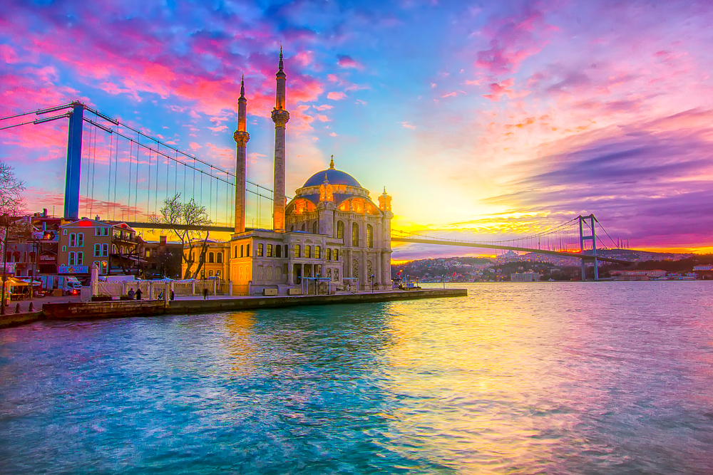 Ortakoy landscape pictured at sunrise looking toward the mosque from the water in Istanbul, one of the best places to visit in Turkey