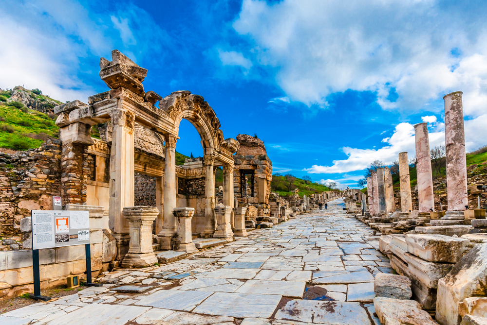 Ancient ruins in the city of Ephesus with a blue sky in the background