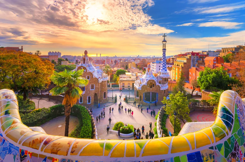 Neat dusk view of the Park Guell in Barcelona, as seen at dusk from behind the colorful snake-like wall