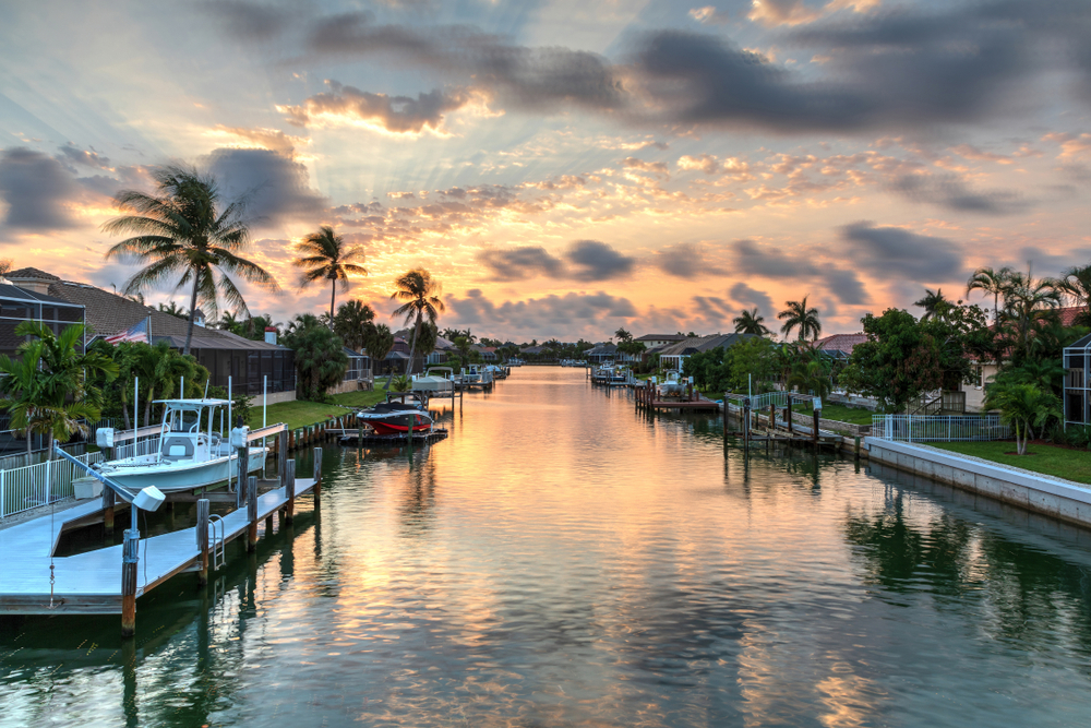 Harbor leading to the ocean pictured during the best time to visit Marco Island at dusk