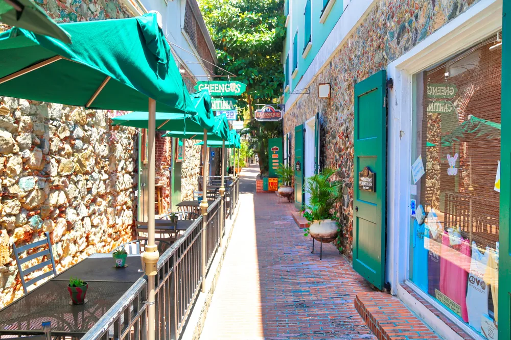 Charlotte Amalie street with cafes on either side pictured during the overall least busy time to visit St. Thomas