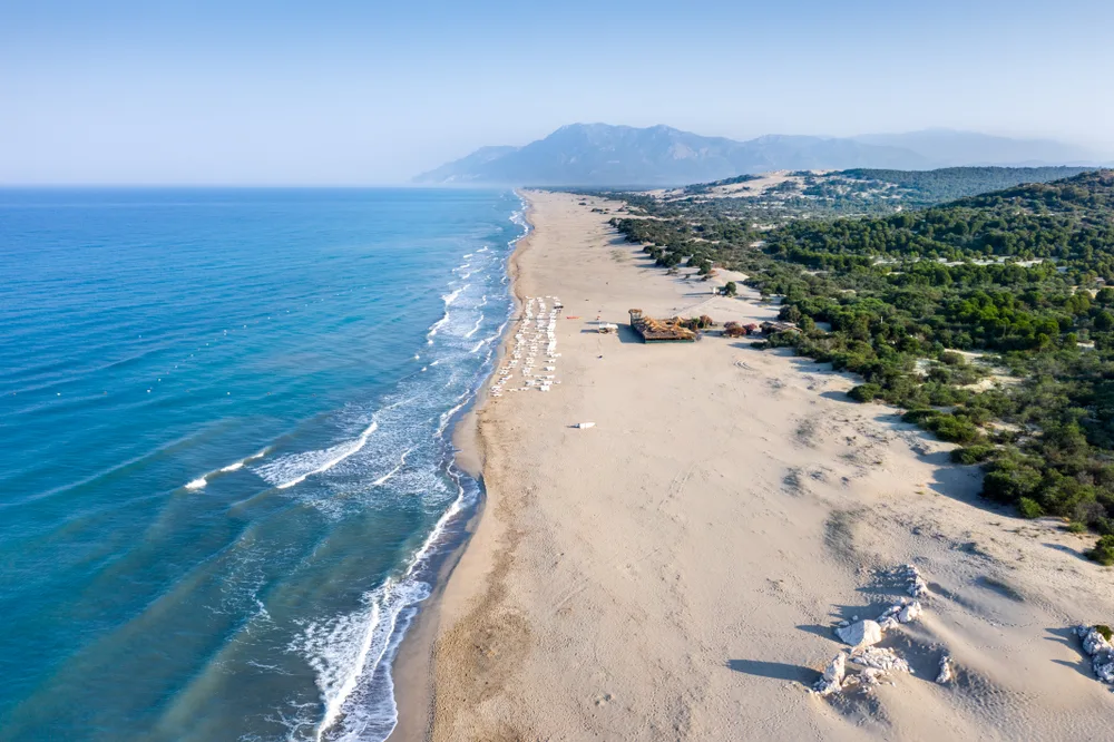 Patara Beach pictured from the air with an expansive coastline with white sand stretching on for miles
