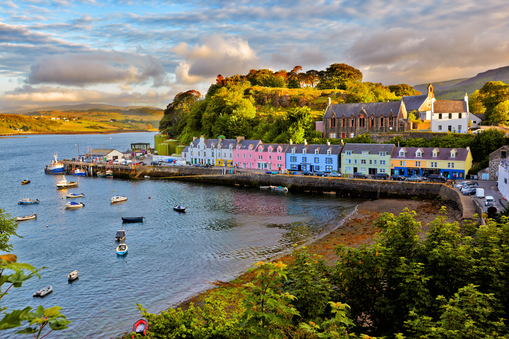 Neat view of the waterside down of Portree, one of the best places to visit in Scotland, as seen at sundown