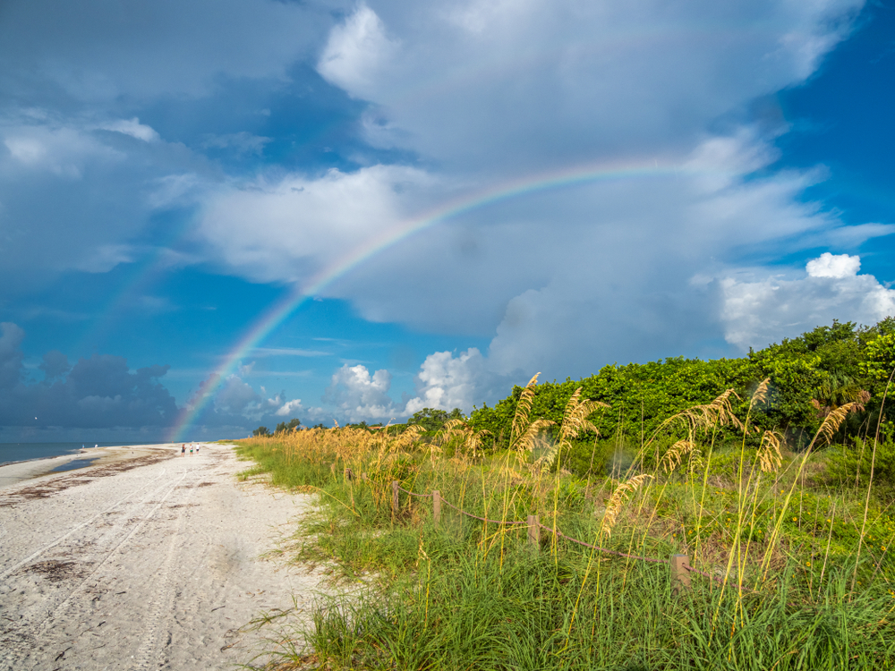 Rainbow over the vegetation and beach at Sanibel Island during the best time to visit