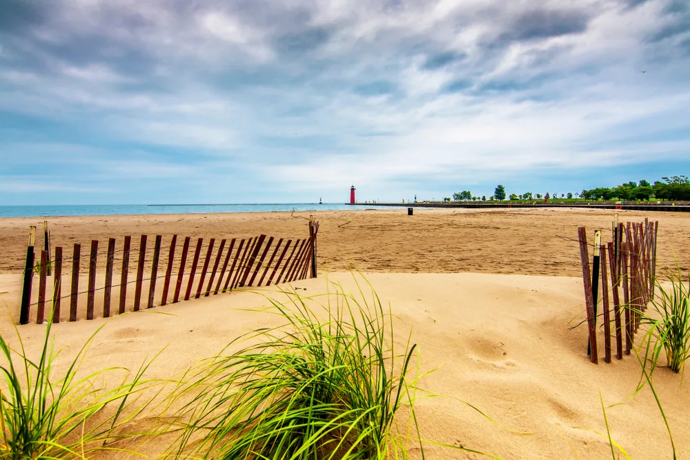 Kenosha WI beach and lighthouse pictured for a piece on the best day trips to take from Chicago