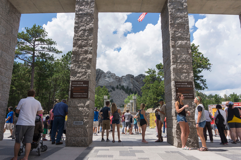 Crowded day pictured during the summer, the worst time to visit Mount Rushmore, with lots of people crowding the common area